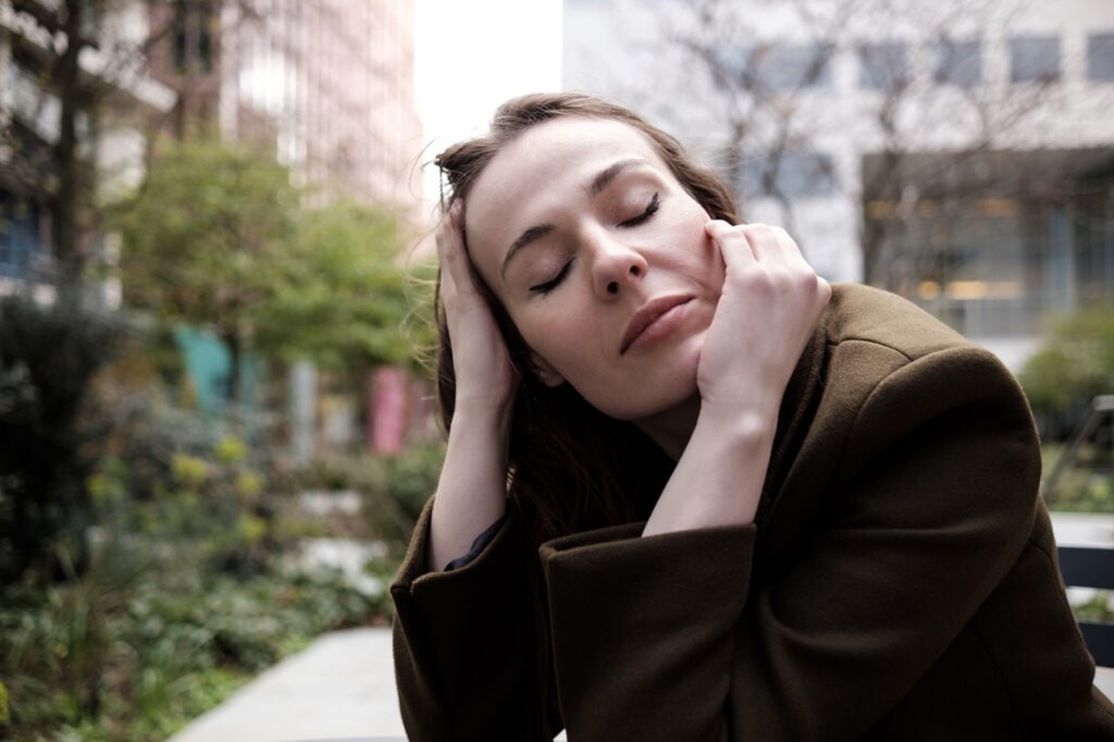 Woman thinking about How to get rid of weed hangover.