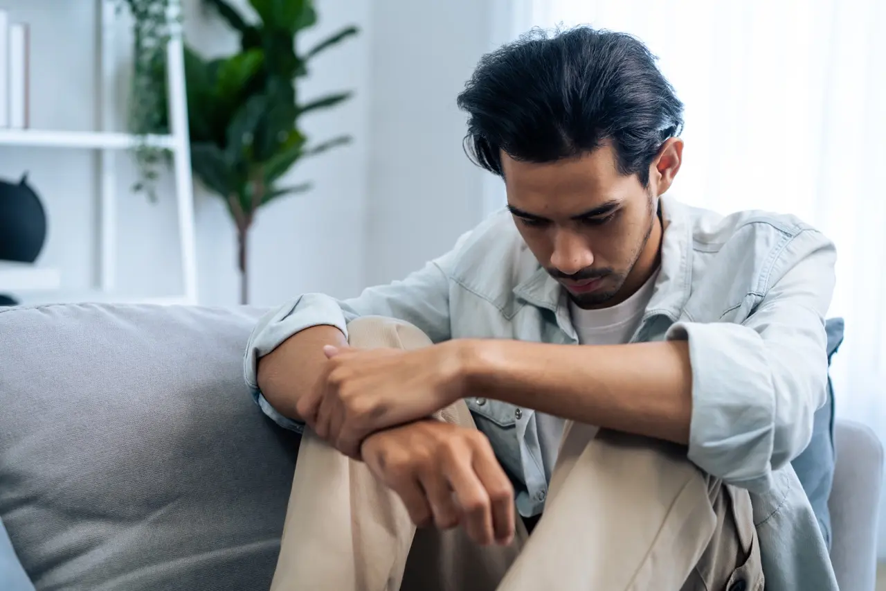 The Grove Recovery | asian young upset depressed man sitting alone in l 2026 01 09 07 34 29 utc Large