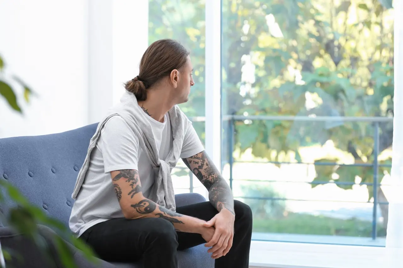 The Grove Recovery | young man with stylish tattoos at home space for 2026 03 05 11 52 44 utc Large