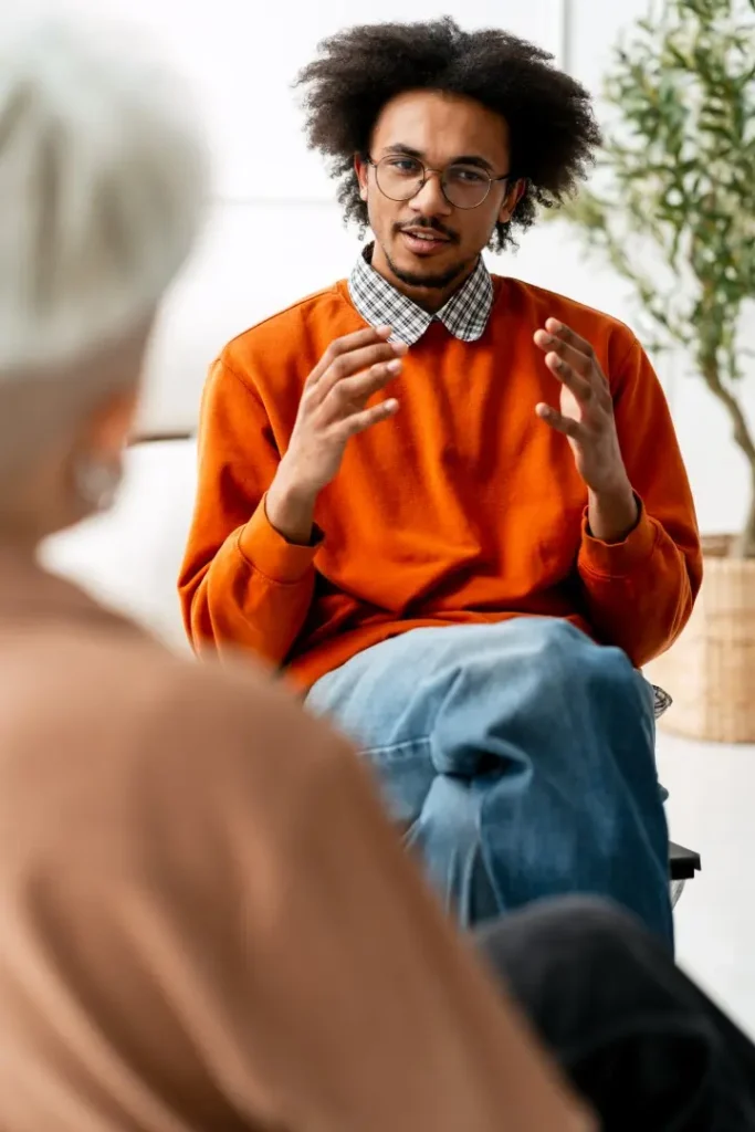 The Grove Recovery | young black man counseling older person during the 2026 04 17 21 59 11 utc