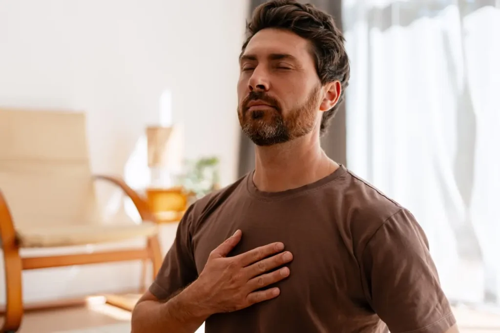 The Grove Recovery | man meditating at home for health and wellness 2026 01 08 00 12 23 utc Large
