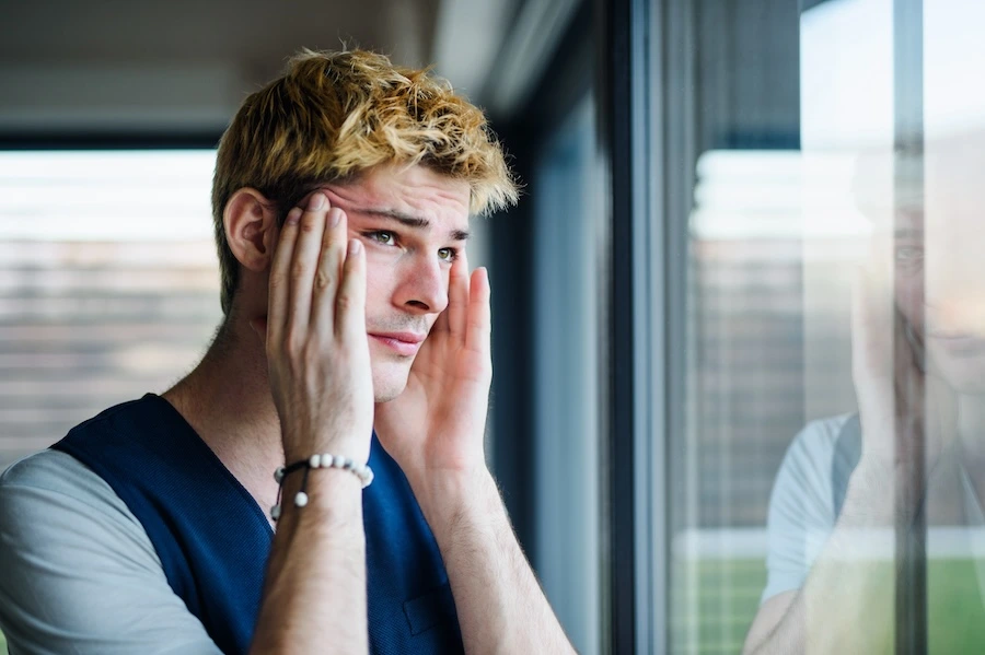 man struggling from anger management and addiction
