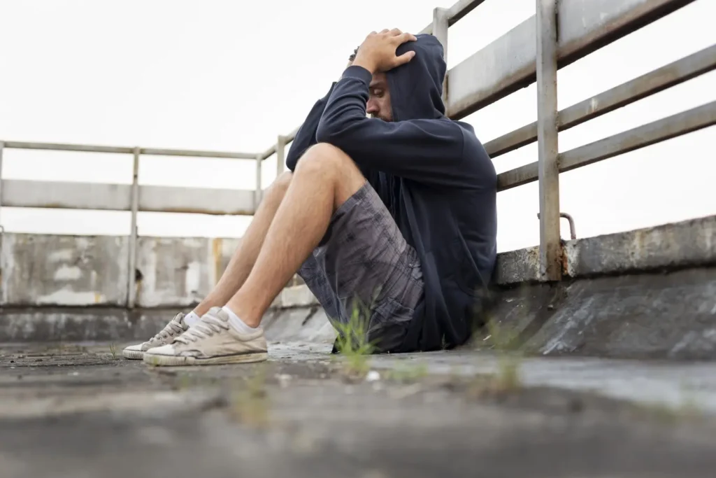 The Grove Recovery | man in hoodie sitting head in hands 2026 03 24 16 49 05 utc