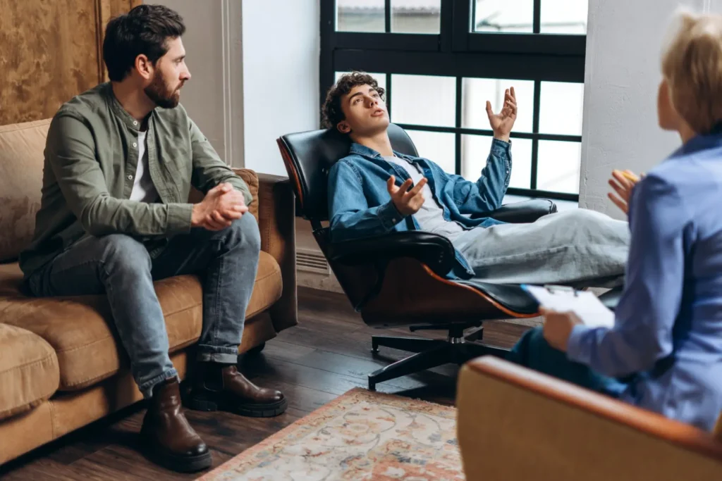 The Grove Recovery | man in therapy session with counselor and partner 2026 03 25 04 39 49 utc